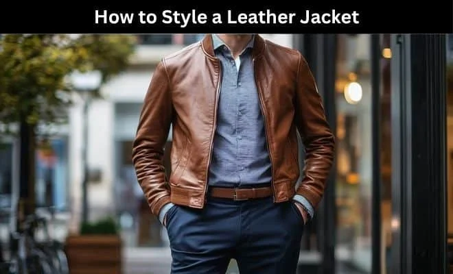 Man wearing a stylish brown leather jacket in an urban setting.